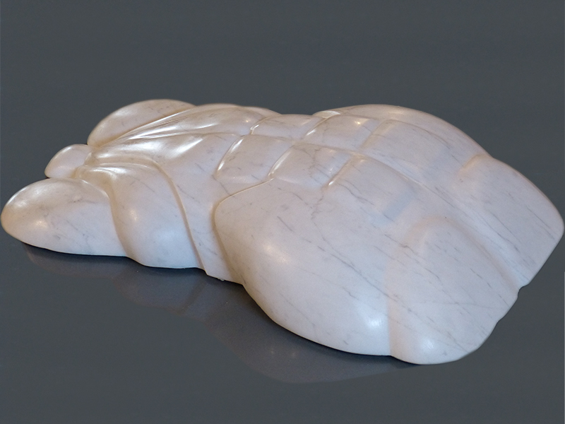 IZA, Isabelle Ardevol, woman contemporary artist, sculptress, art, To our distant love is a marble sculpture carved in 2020. It's part of the In Chaotic lands serie, inspired y the societal changes due to Covid and global warming. Carved in recycled marble block